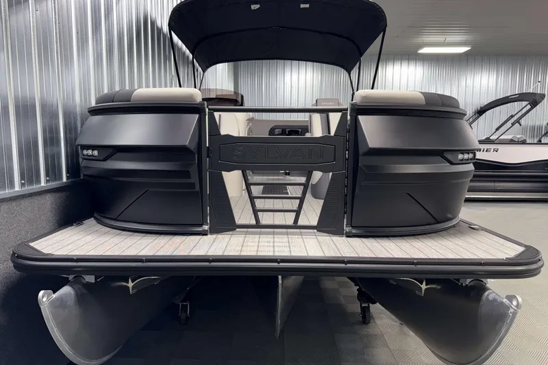 Slide: The Image of 2026 Sylvan L3 CLZ DH Platinum pontoon boat in showroom, sleek design, modern features. - 21
