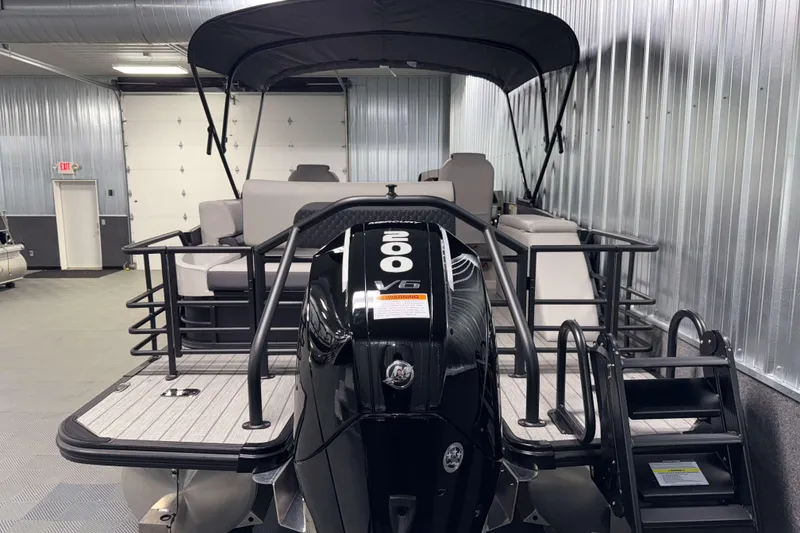 Slide: The Image of 2026 Sylvan L3 CLZ DH Platinum pontoon boat with V6 engine in a showroom. - 28