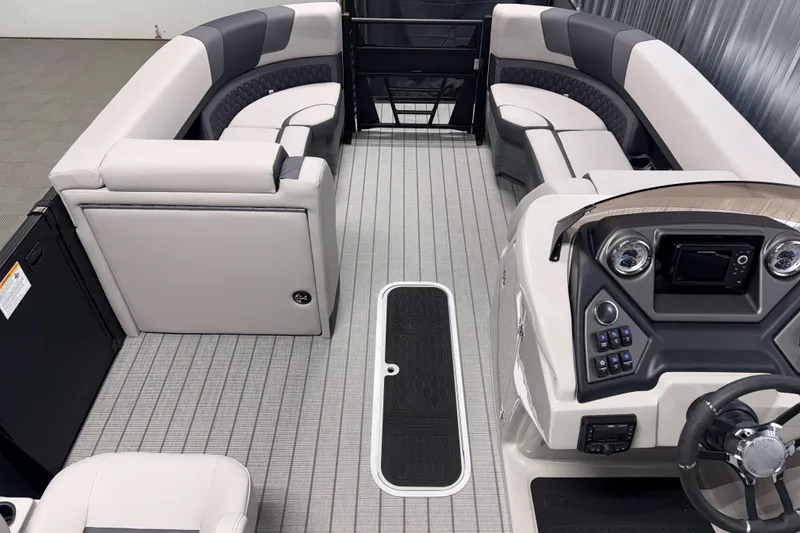 Slide: The Image of Interior of 2026 Sylvan L3 CLZ DH Platinum pontoon boat with modern seating and controls. - 6