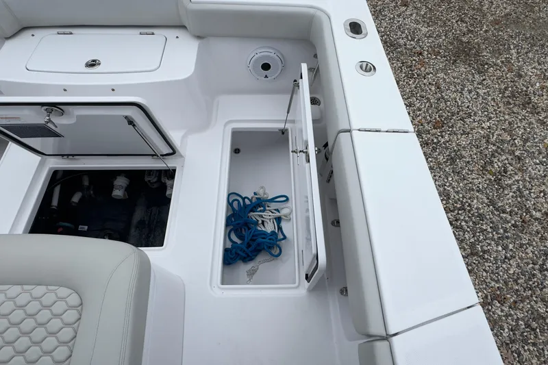 Slide: The Image of 2024 Jupiter 32 FS boat storage compartments with ropes and seating detail. - 18