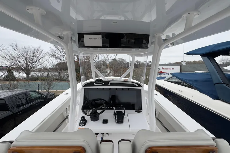 Slide: The Image of 2024 Jupiter 32 FS boat cockpit with modern steering and navigation system. - 25