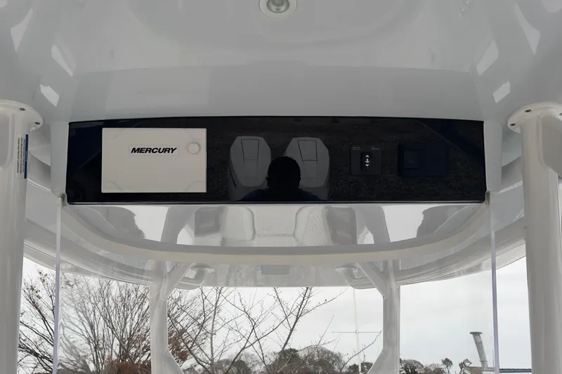 Slide: The Image of 2024 Jupiter 32 FS boat console with Mercury controls and display. - 33