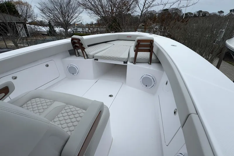 Slide: The Image of 2024 Jupiter 32 FS boat interior with cushioned seating and sleek design. - 39