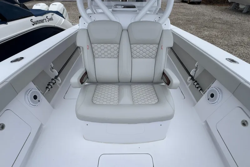 Slide: The Image of 2024 Jupiter 32 FS boat interior with cushioned seating and modern design. - 43