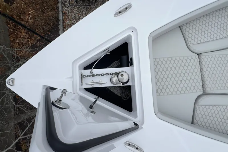 Slide: The Image of 2024 Jupiter 32 FS boat bow with anchor storage and cushioned seating. - 51