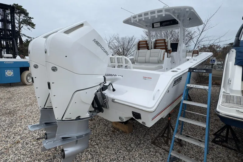 Slide: The Image of 2024 Jupiter 32 FS boat with dual Mercury outboard engines on display. - 6