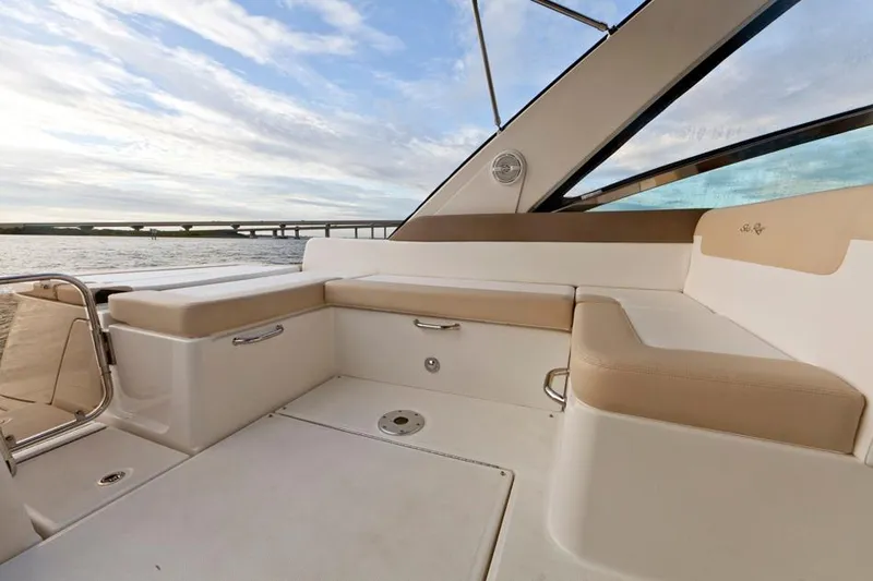 Slide: The Image of Manufacturer Provided Image: 2015 Sea Ray 370 Venture boat interior with beige seating and water view. - 5