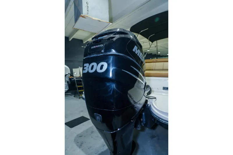 Slide: The Image of 2015 Sea Ray 270 Sundeck with powerful Mercury 300 outboard engine in showroom. - 40