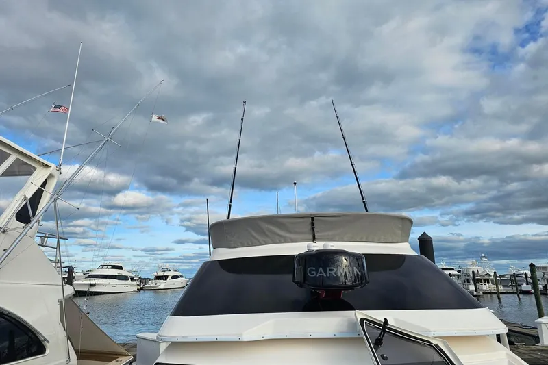 Slide: The Image of 2026 Solara S-310 SB yacht docked at marina under cloudy sky. - 13