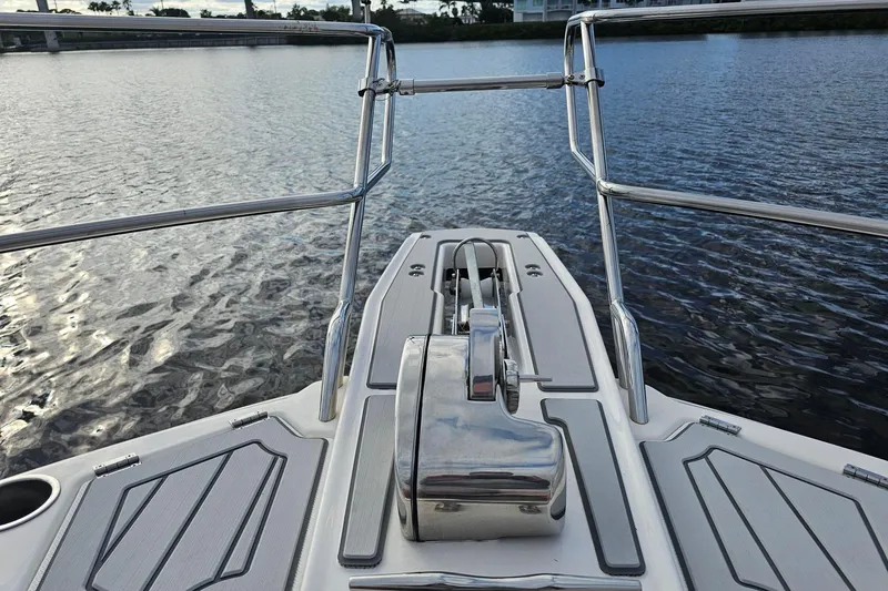 Slide: The Image of Bow view of 2026 Solara S-310 SB boat on calm water. - 15