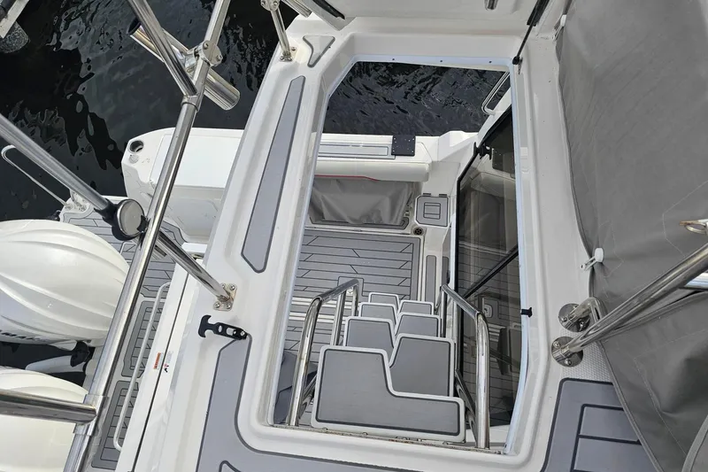 Slide: The Image of Staircase view on Solara S-310 SB boat, 2026 model, with sleek design and modern features. - 17