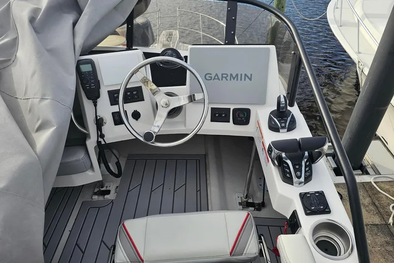 Slide: The Image of Cockpit of 2026 Solara S-310 SB boat with Garmin navigation system and controls. - 19