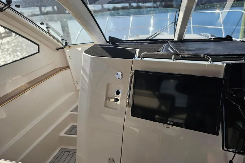 Slide: The Image of Interior of 2026 Solara S-310 SB boat with modern dashboard and sleek design. - 20