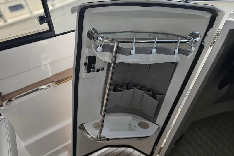 Slide: The Image of Interior storage compartment of 2026 Solara S-310 SB boat. - 21