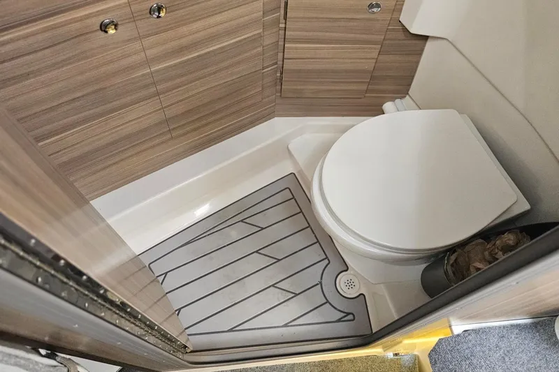 Slide: The Image of Compact bathroom in 2026 Solara S-310 SB with modern wood paneling and toilet. - 26