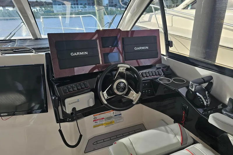 Slide: The Image of Helm of 2026 Solara S-310 SB boat with Garmin navigation displays. - 5