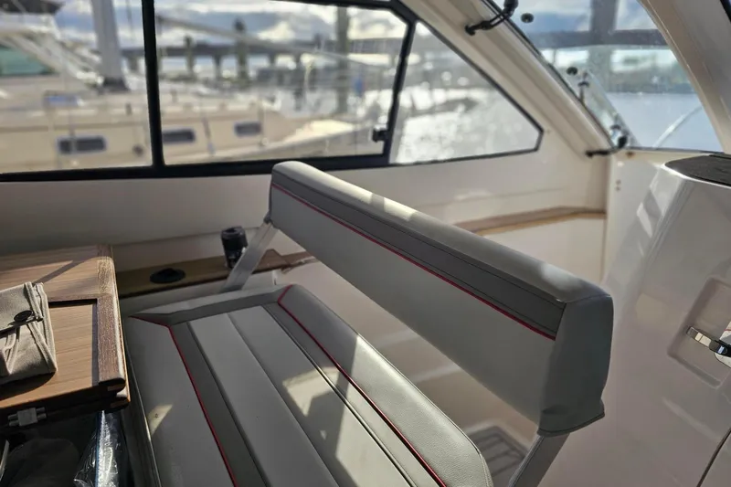 Slide: The Image of Interior of 2026 Solara S-310 SB boat with sleek seating and window view. - 9
