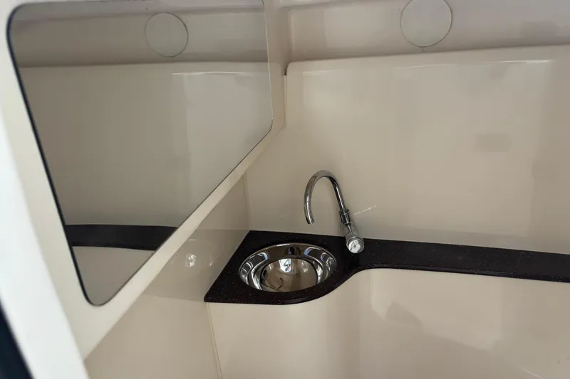 Slide: The Image of 2017 Scout 255 Dorado boat interior with sink and countertop. - 12