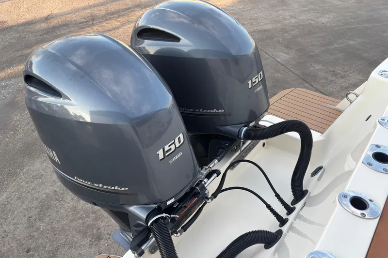 Slide: The Image of Twin Yamaha 150 outboard engines on a 2017 Scout 255 Dorado boat. - 8