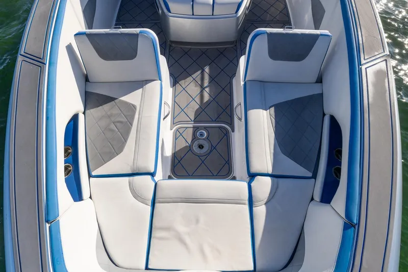 Slide: The Image of 2019 Deep Impact 399 Sport boat interior with blue and gray seating. - 12