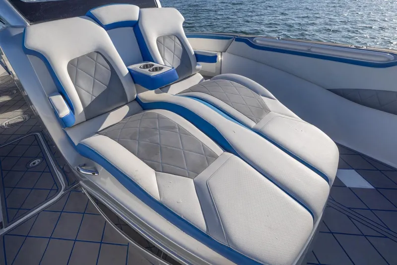 Slide: The Image of Luxurious seating on 2019 Deep Impact 399 Sport boat with blue and gray upholstery. - 18