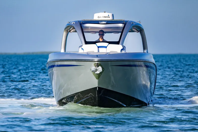 Slide: The Image of 2019 Deep Impact 399 Sport boat cruising on open water. - 3