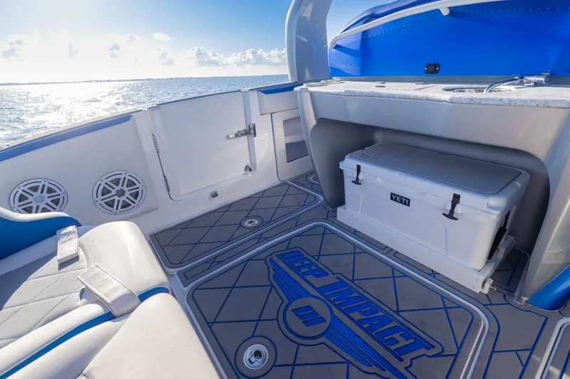 Slide: The Image of Interior of 2019 Deep Impact 399 Sport boat with Yeti cooler and ocean view. - 31