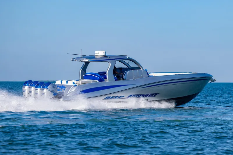 Slide: The Image of 2019 Deep Impact 399 Sport boat cruising on open water. - 42