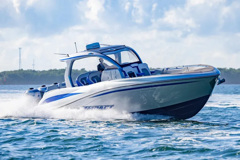 Slide: The Image of 2019 Deep Impact 399 Sport boat cruising on open water, showcasing sleek design and performance. - 46
