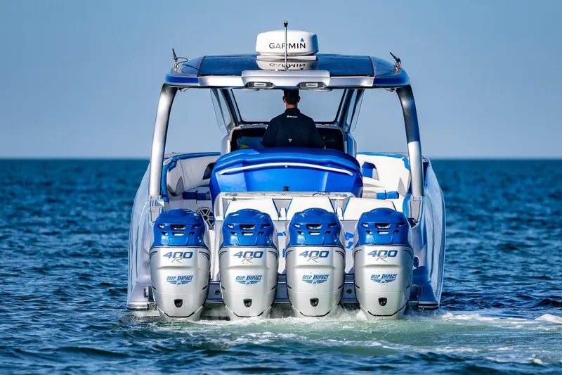 Slide: The Image of 2019 Deep Impact 399 Sport boat with four powerful engines on open water. - 5