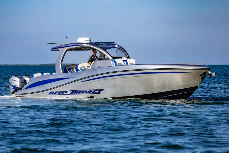 Slide: The Image of 2019 Deep Impact 399 Sport boat cruising on open water. - 8