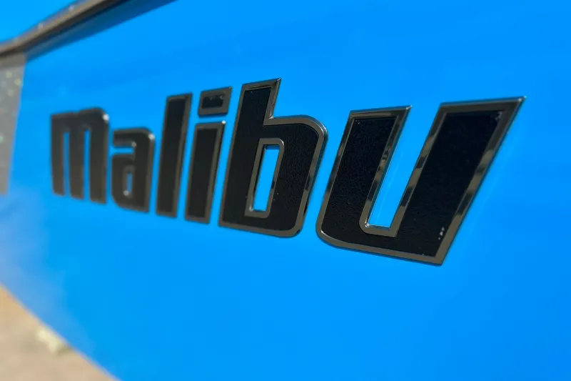Slide: The Image of Close-up of 2019 Malibu Wakesetter 24 MXZ logo on blue background. - 15
