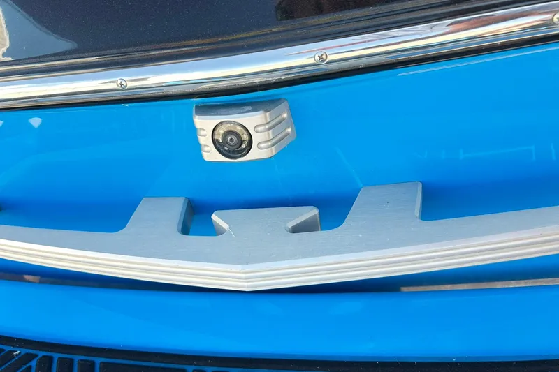 Slide: The Image of 2019 Malibu Wakesetter 24 MXZ rear camera and trim detail in blue. - 20