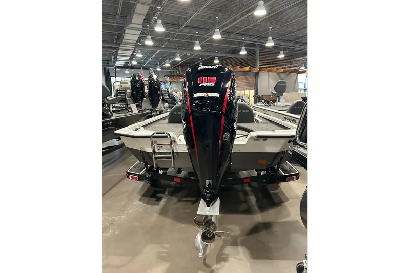 Slide: The Image of Clothing store interior with 2024 Vexus AVX1880C boats in the background. - 11