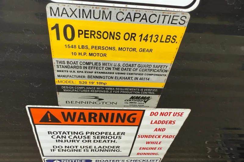 Slide: The Image of Safety and capacity labels on a 2015 Bennington 18 SLX boat. - 26