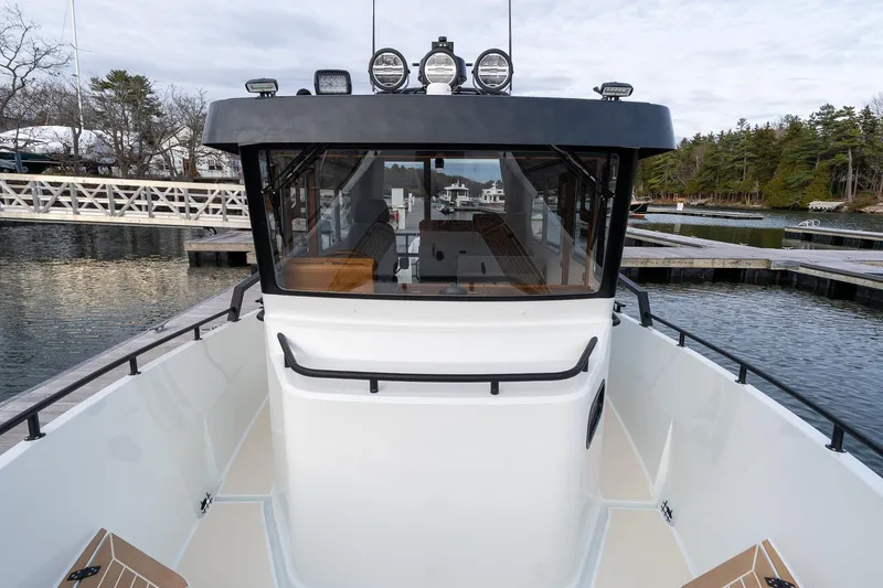 Slide: The Image of 2026 Targa 27.2 boat docked, showcasing sleek design and spacious deck. - 17