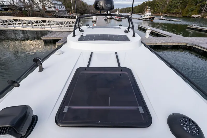 Slide: The Image of 2026 Targa 27.2 boat deck with solar panel and hatch, docked at marina. - 21
