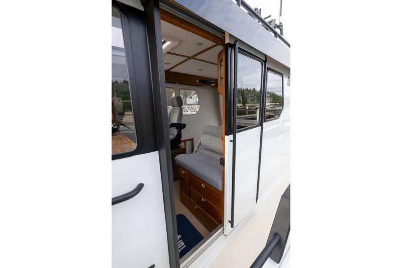 Slide: The Image of 2026 Targa 27.2 boat interior with seating and wooden accents. - 23