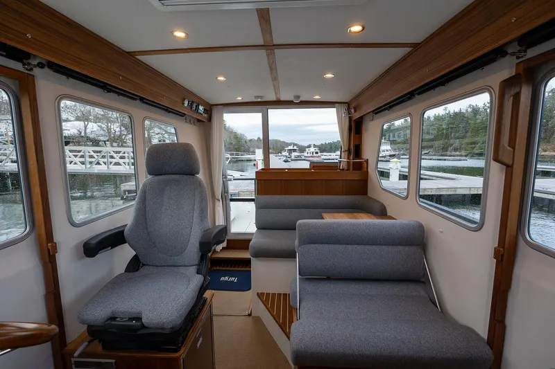 Slide: The Image of Interior of 2026 Targa 27.2 boat with modern seating and large windows. - 27