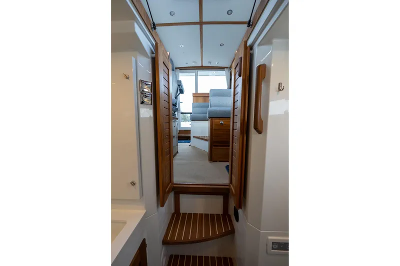 Slide: The Image of Interior view of 2026 Targa 27.2 boat, featuring wooden steps and modern design. - 47