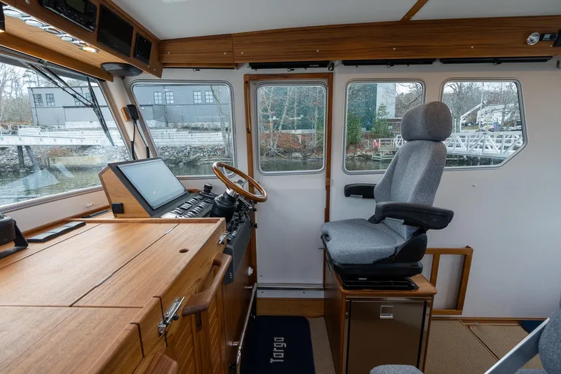 Slide: The Image of Interior of 2026 Targa 27.2 boat, featuring helm station with modern controls and comfortable seating. - 49