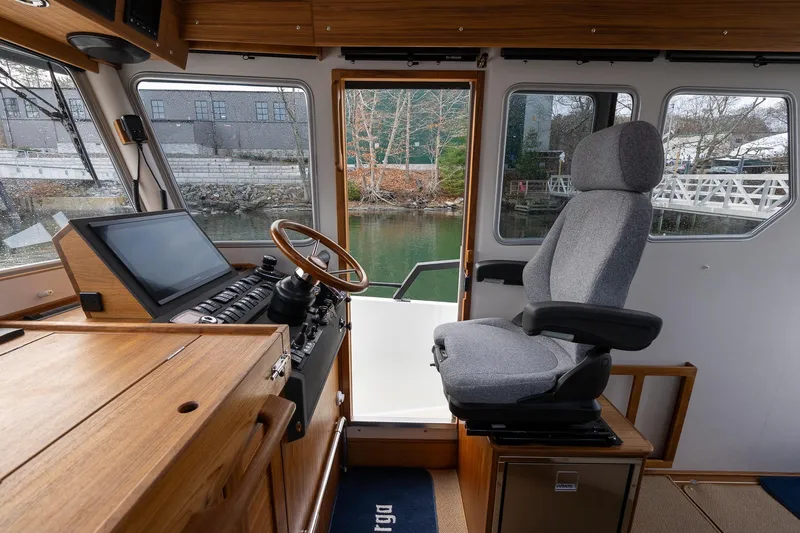 Slide: The Image of Interior of 2026 Targa 27.2 boat, featuring helm station and comfortable seating. - 50