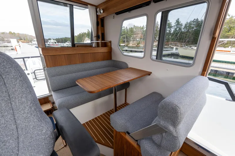 Slide: The Image of Interior of 2026 Targa 27.2 boat with cozy seating and wooden table. - 55