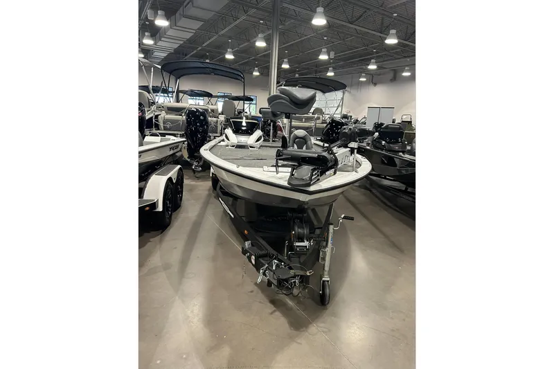 Slide: The Image of 2024 Vexus AVX1880C boat displayed in a showroom with modern lighting. - 2