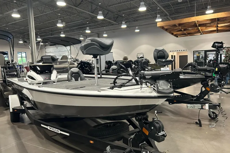 Slide: The Image of 2024 Vexus AVX1880C boat displayed in a showroom with modern lighting. - 3