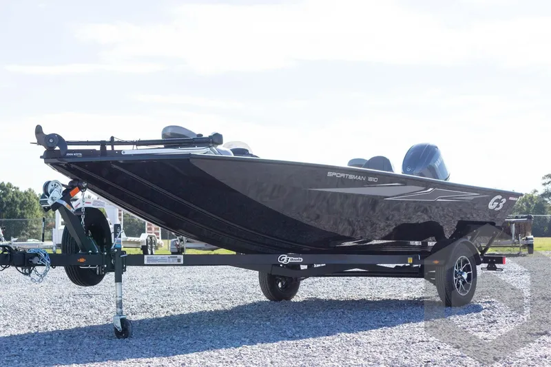 Slide: The Image of 2026 G3 Sportsman 1610 boat on trailer, parked outdoors on gravel. - 10