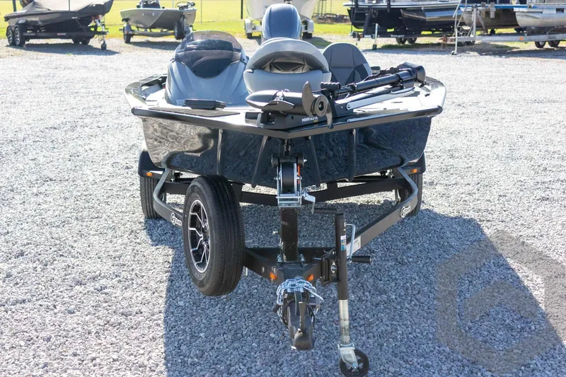 Slide: The Image of 2026 G3 Sportsman 1610 boat on trailer, parked on gravel lot. - 12