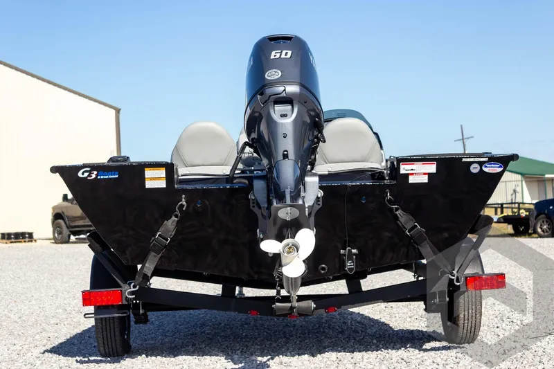 Slide: The Image of 2026 G3 Sportsman 1610 boat with 60 HP motor on trailer, parked outdoors. - 15