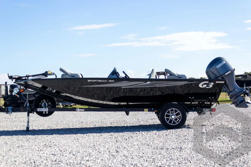 Slide: The Image of 2026 G3 Sportsman 1610 boat on trailer, side view, outdoors. - 18