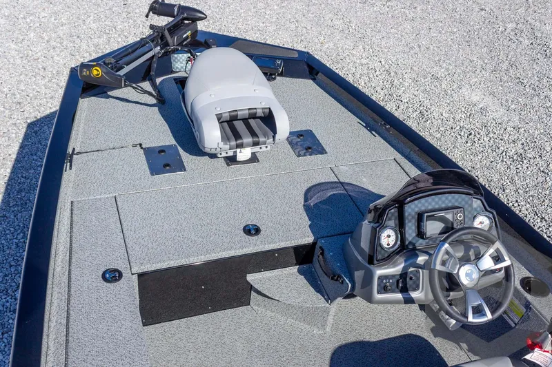 Slide: The Image of 2026 G3 Sportsman 1610 boat interior with steering console and seating. - 26